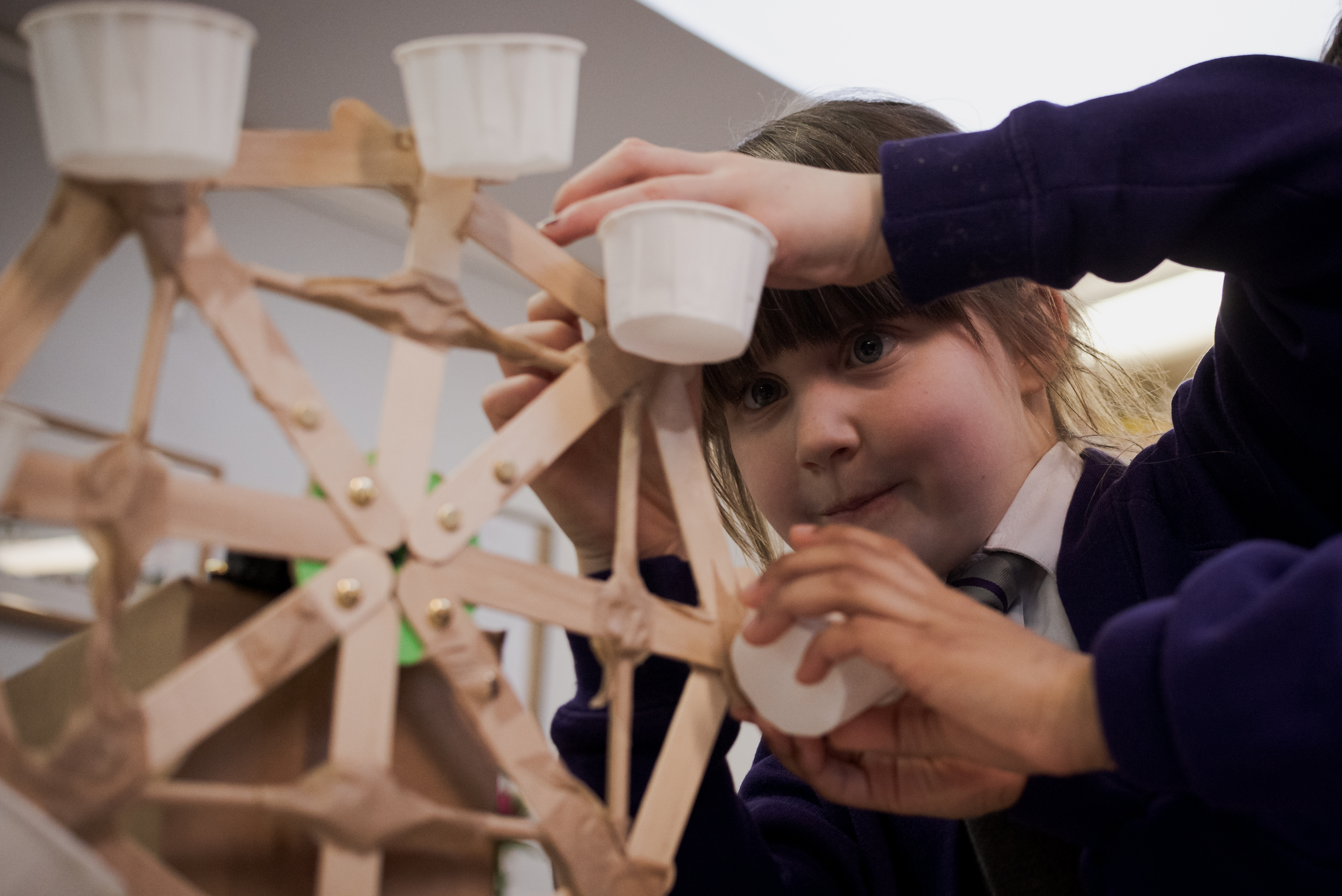 girl building a micro:bit controlled ferris wheel